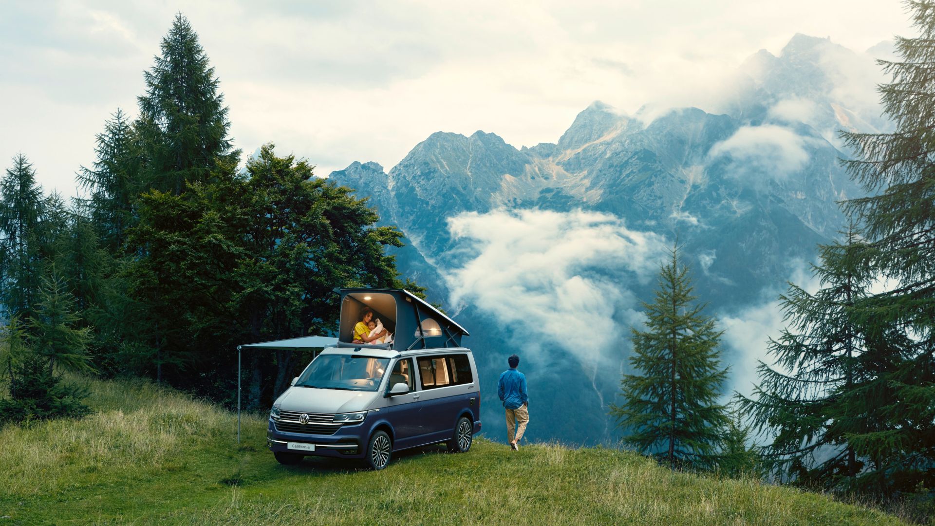 VW California Ocean front and side view with pop-up roof in mountain scenery