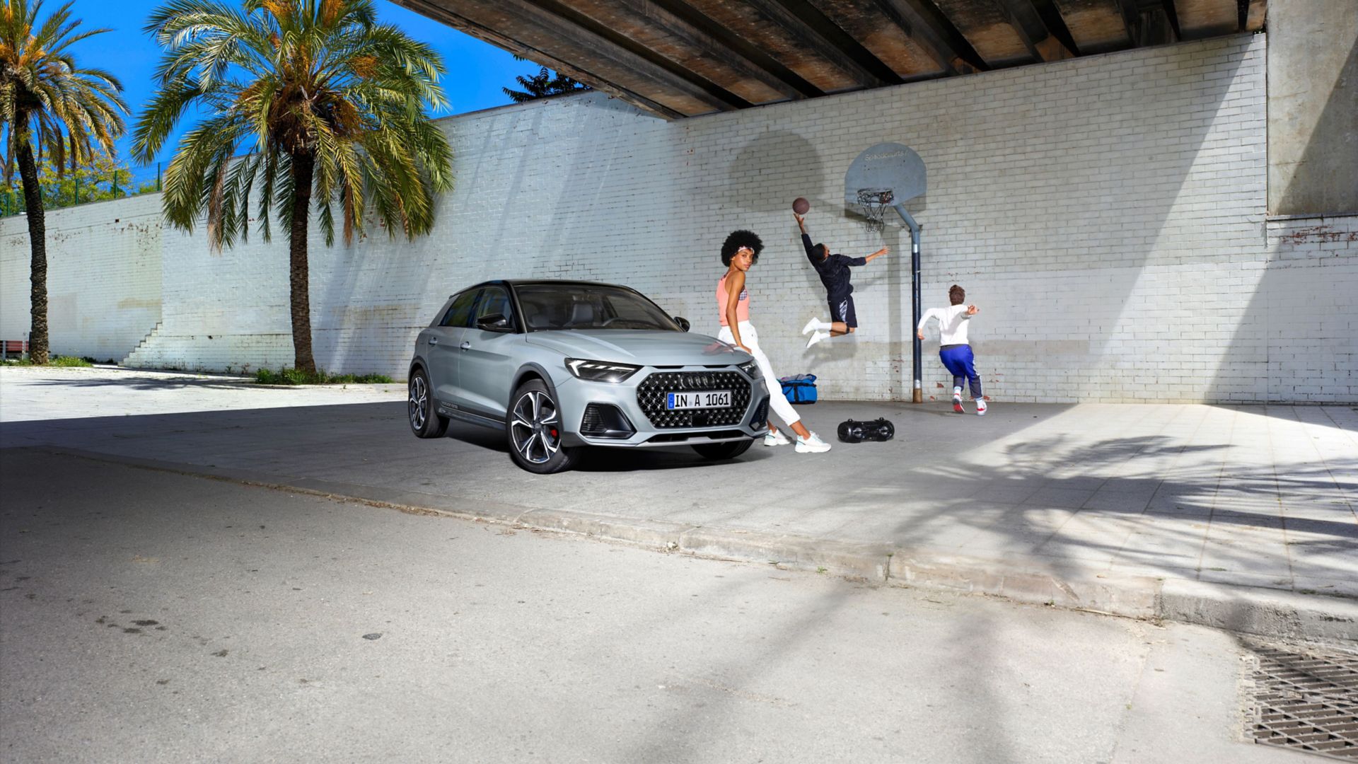 Audi A1 allstreet side view in front of building