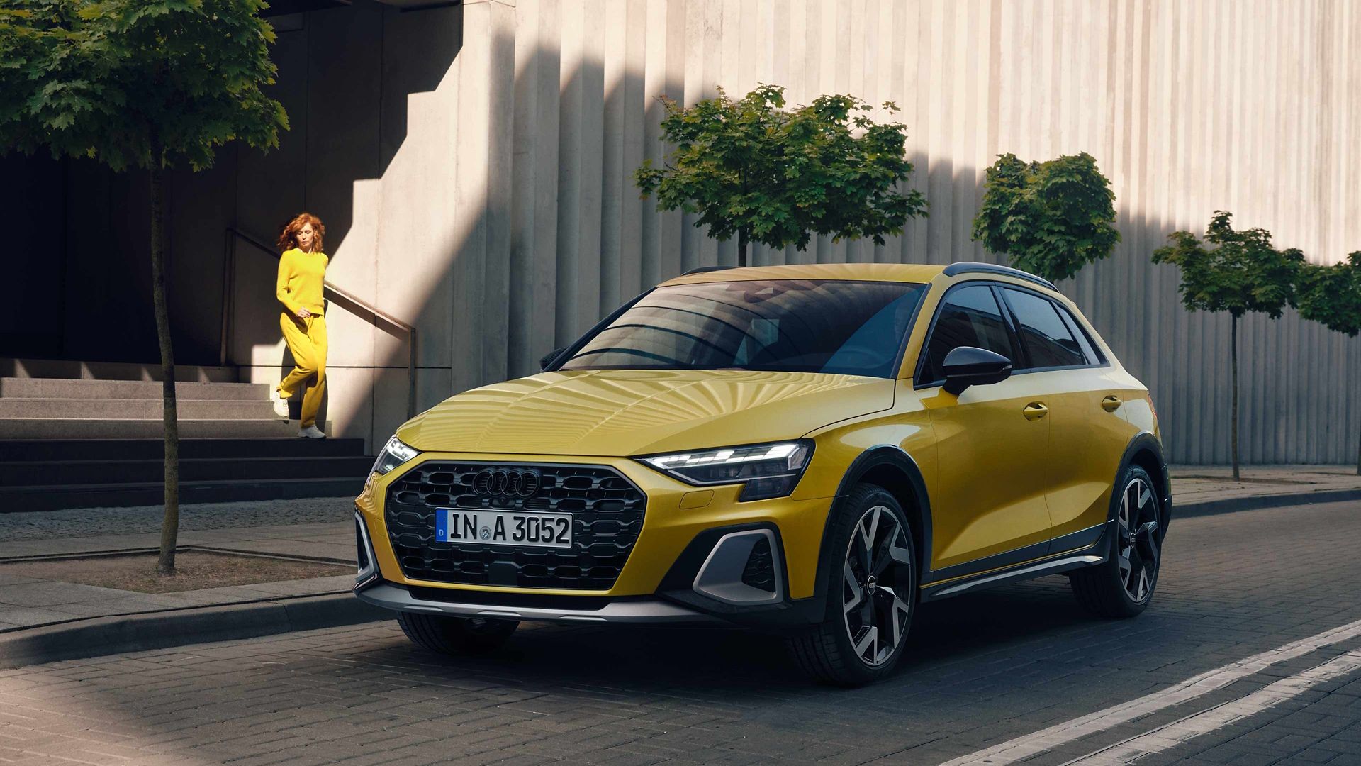 Yellow Audi A3 allstreet front and side view on the street