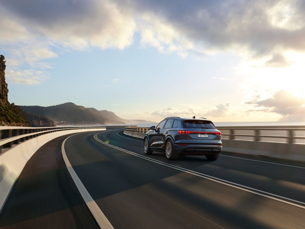 Man charging the Audi Q6 e-tron