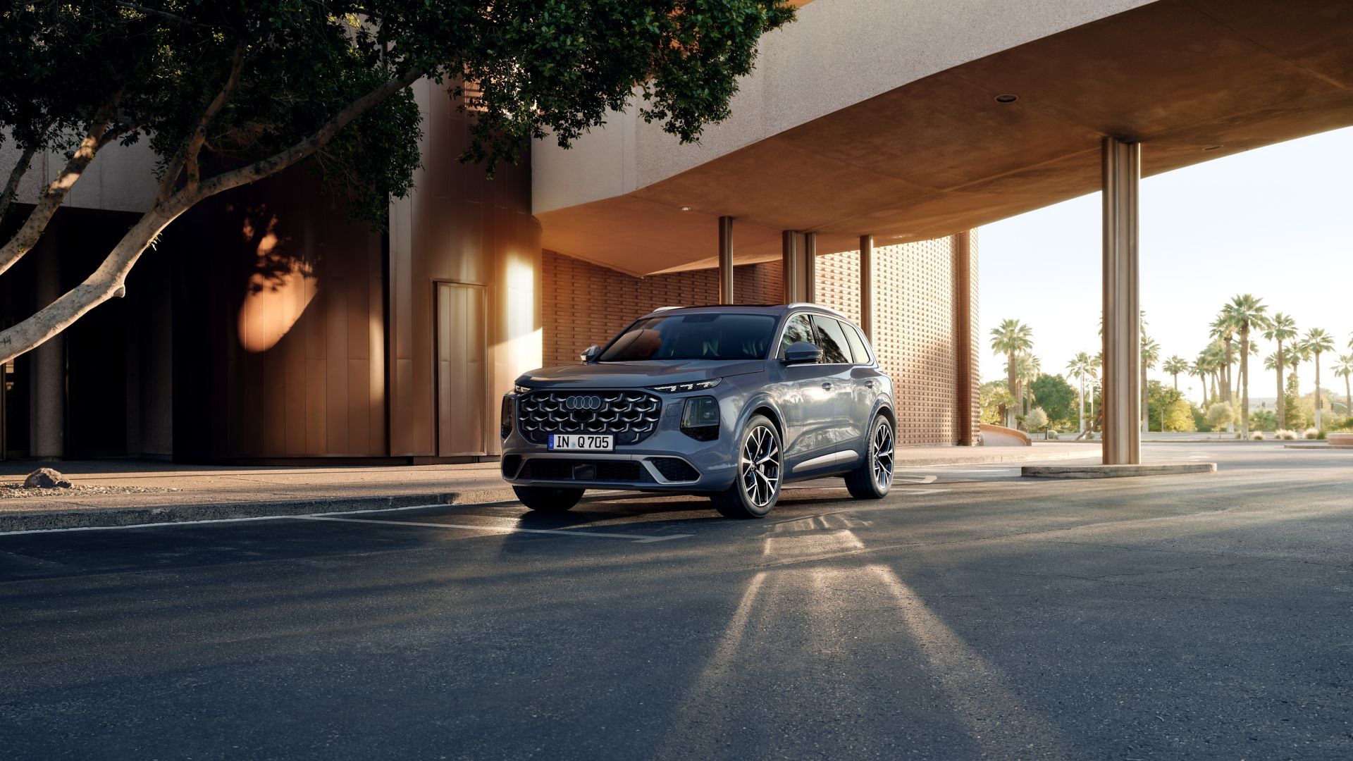 Audi Q7 side view in front of a building