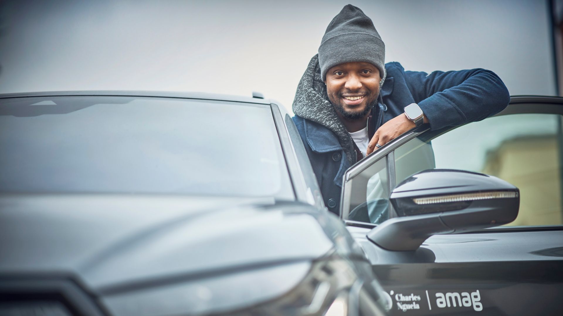 Charles Nguela with AMAG car