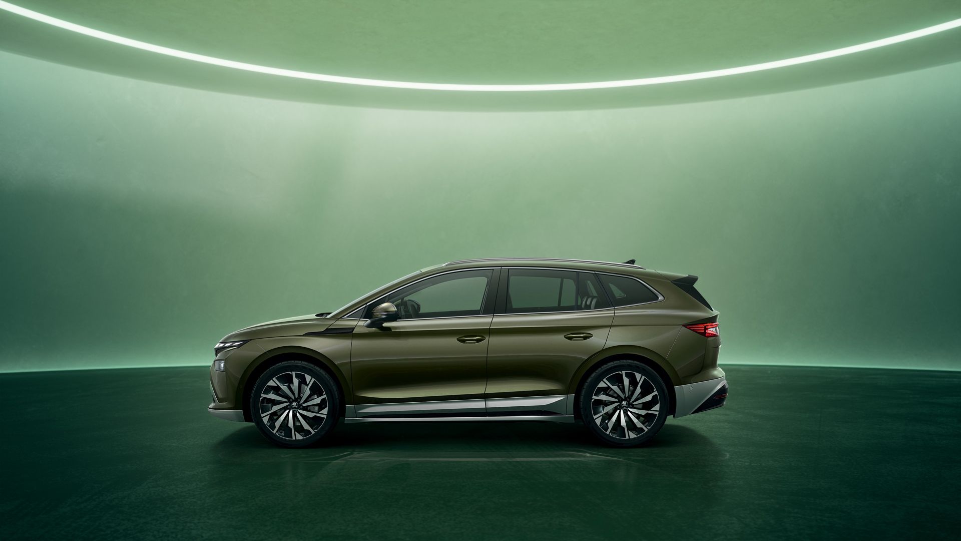 Green Skoda Enyaq side view