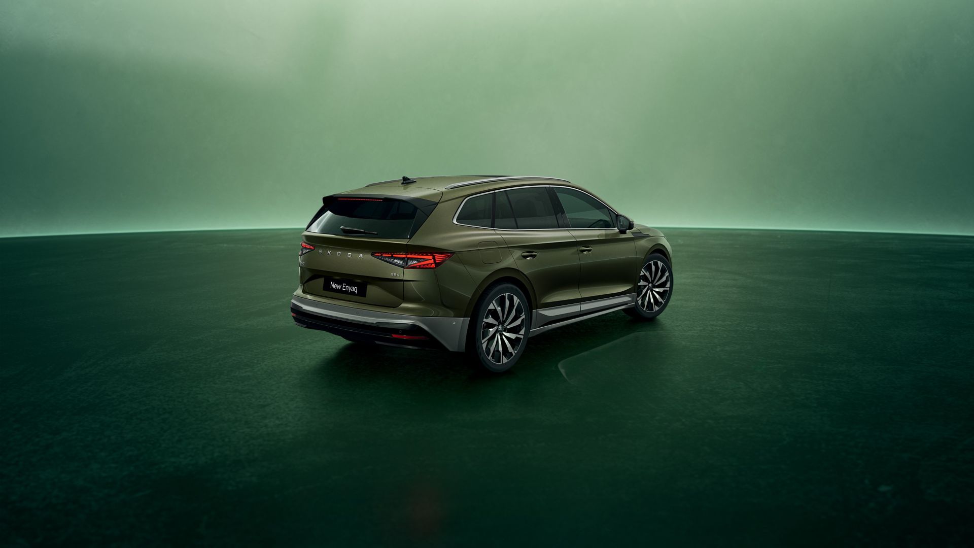 Green Skoda Enyaq rear and side view