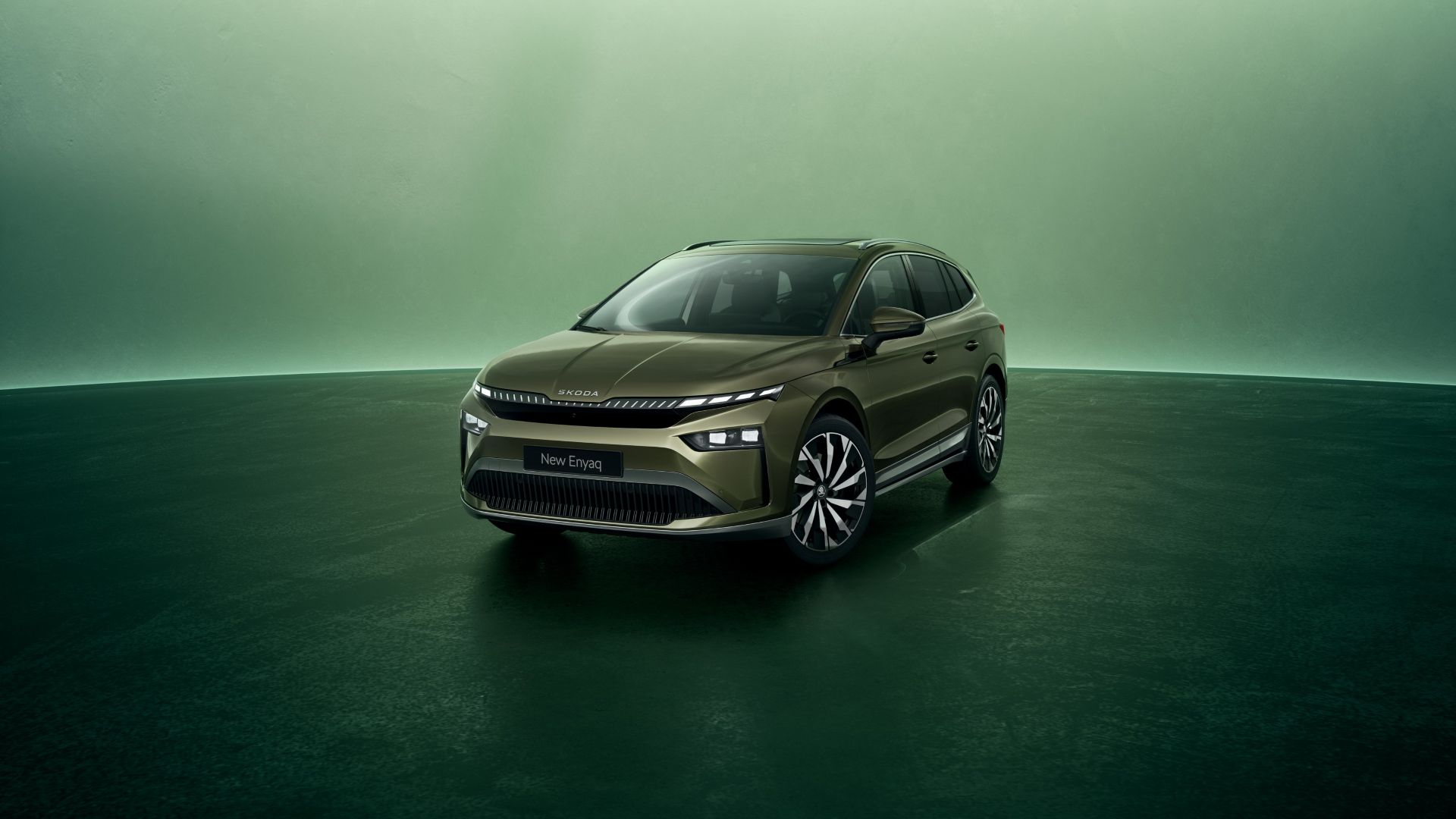 Green Skoda Enyaq front and side view