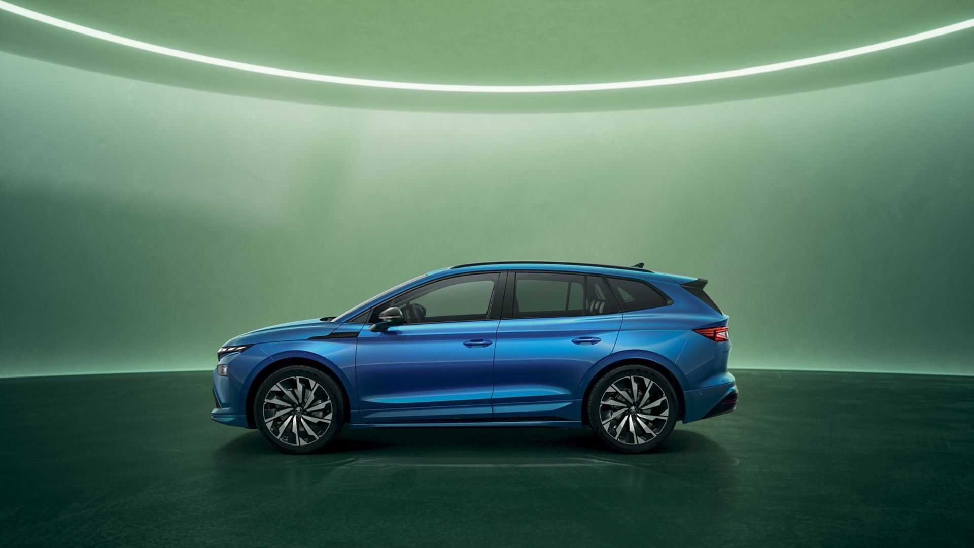 Blue Skoda Enyaq Sportline side view