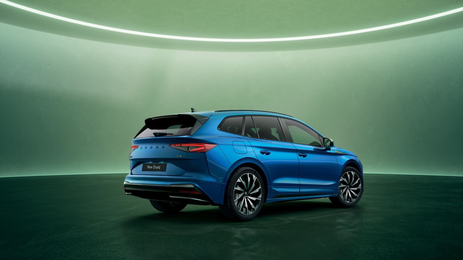 Blue Skoda Enyaq Sportline rear and side view