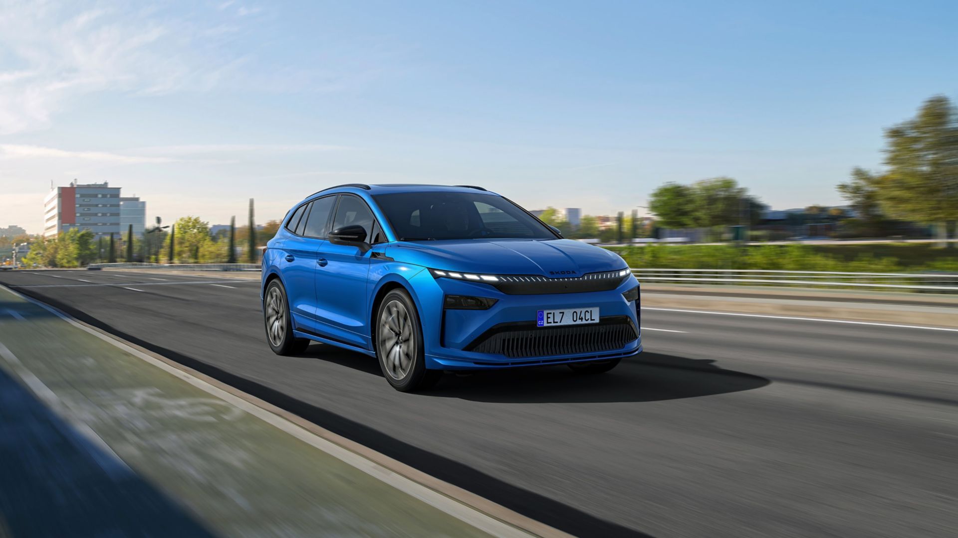 Blue Skoda Enyaq Sportline on a street front view