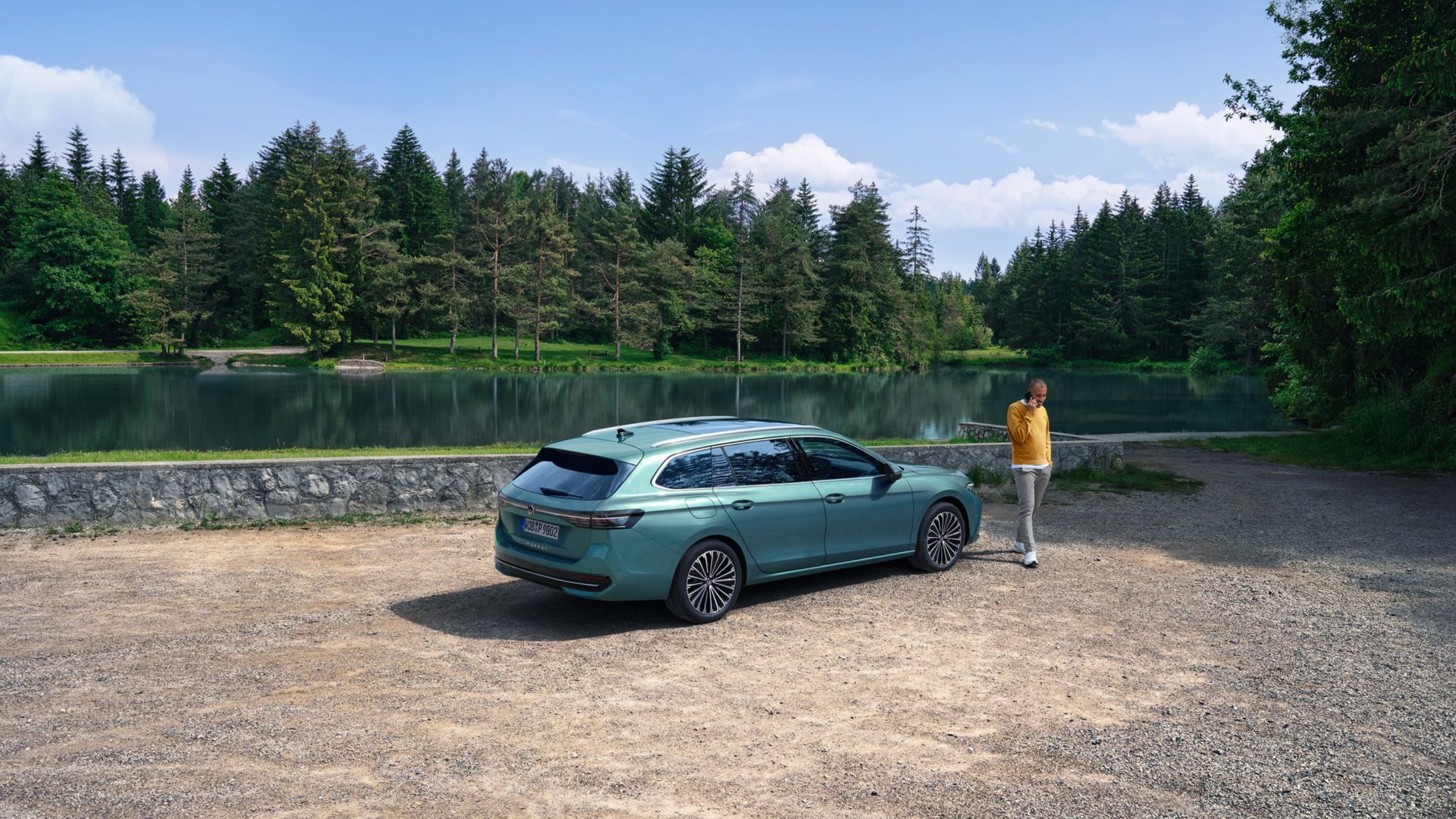Rear/side view of the new VW Passat in a landscape 